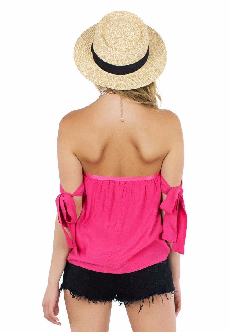 Women outfit in a top rental from Lucca Couture called Guava Off Shoulder Tie Sleeve Top