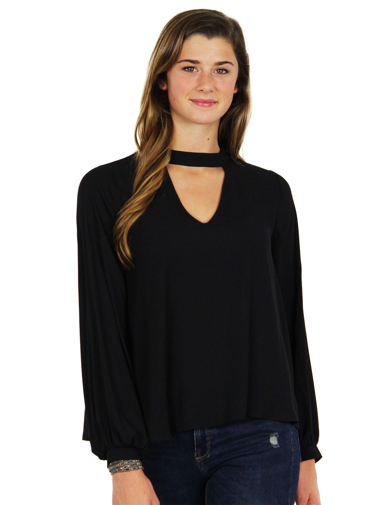 Woman wearing a top rental from Lush called Cut Out Long Sleeve Blouse