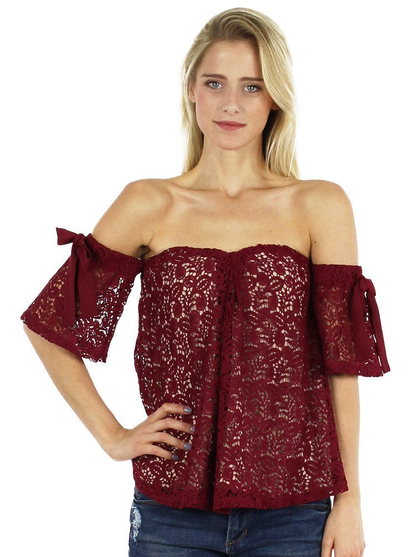 Woman wearing a top rental from Moon River called Off Shoulder Lace Top