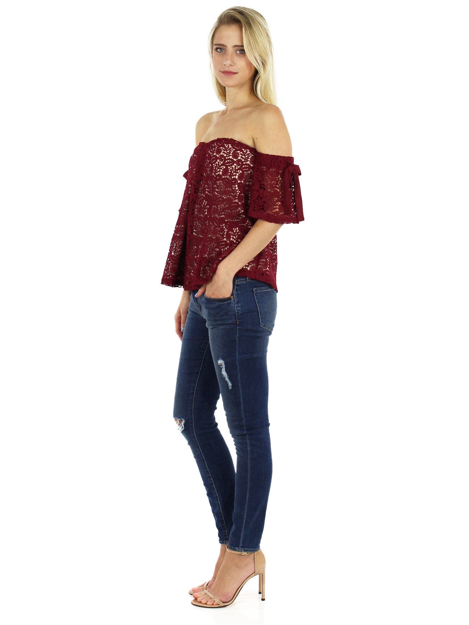 Women outfit in a top rental from Moon River called Off Shoulder Lace Top