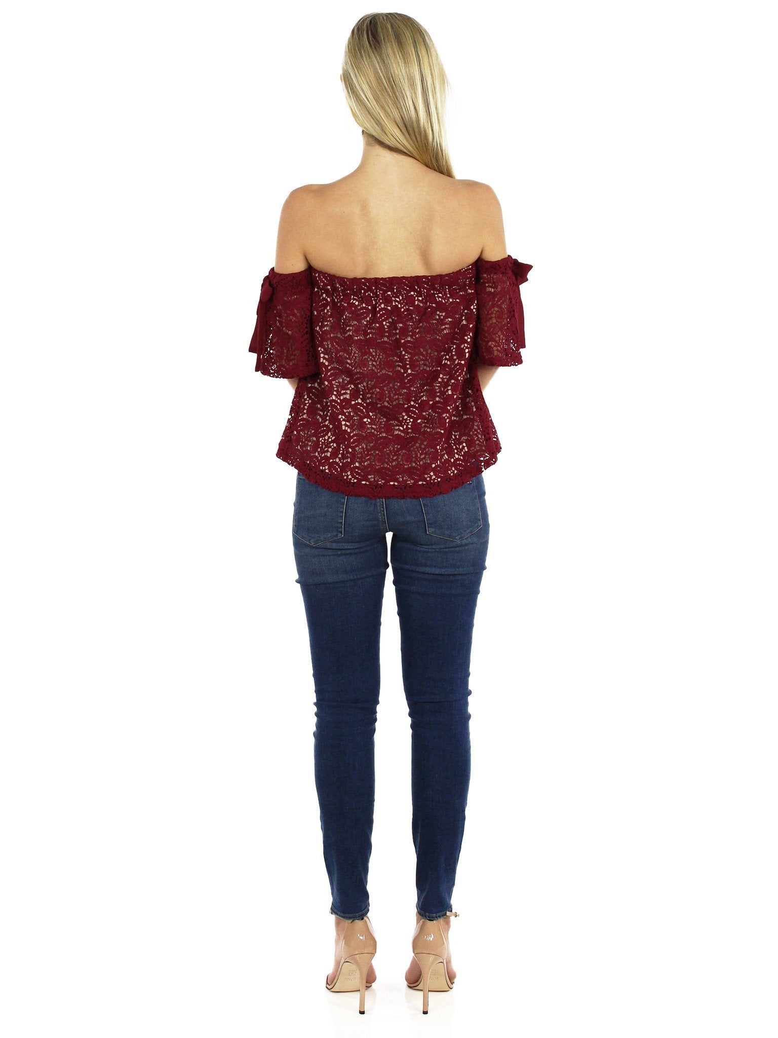 Girl wearing a top rental from Moon River called Off Shoulder Lace Top