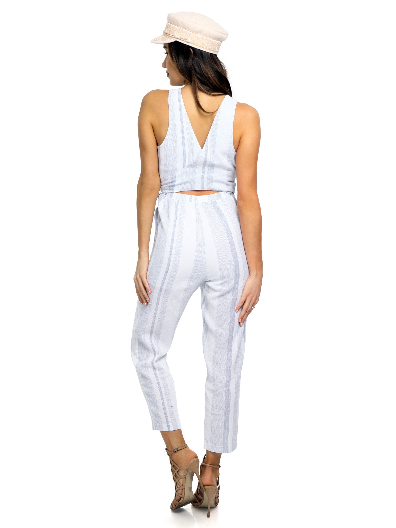 Women wearing a jumpsuit rental from ASTR called Presley Jumpsuit