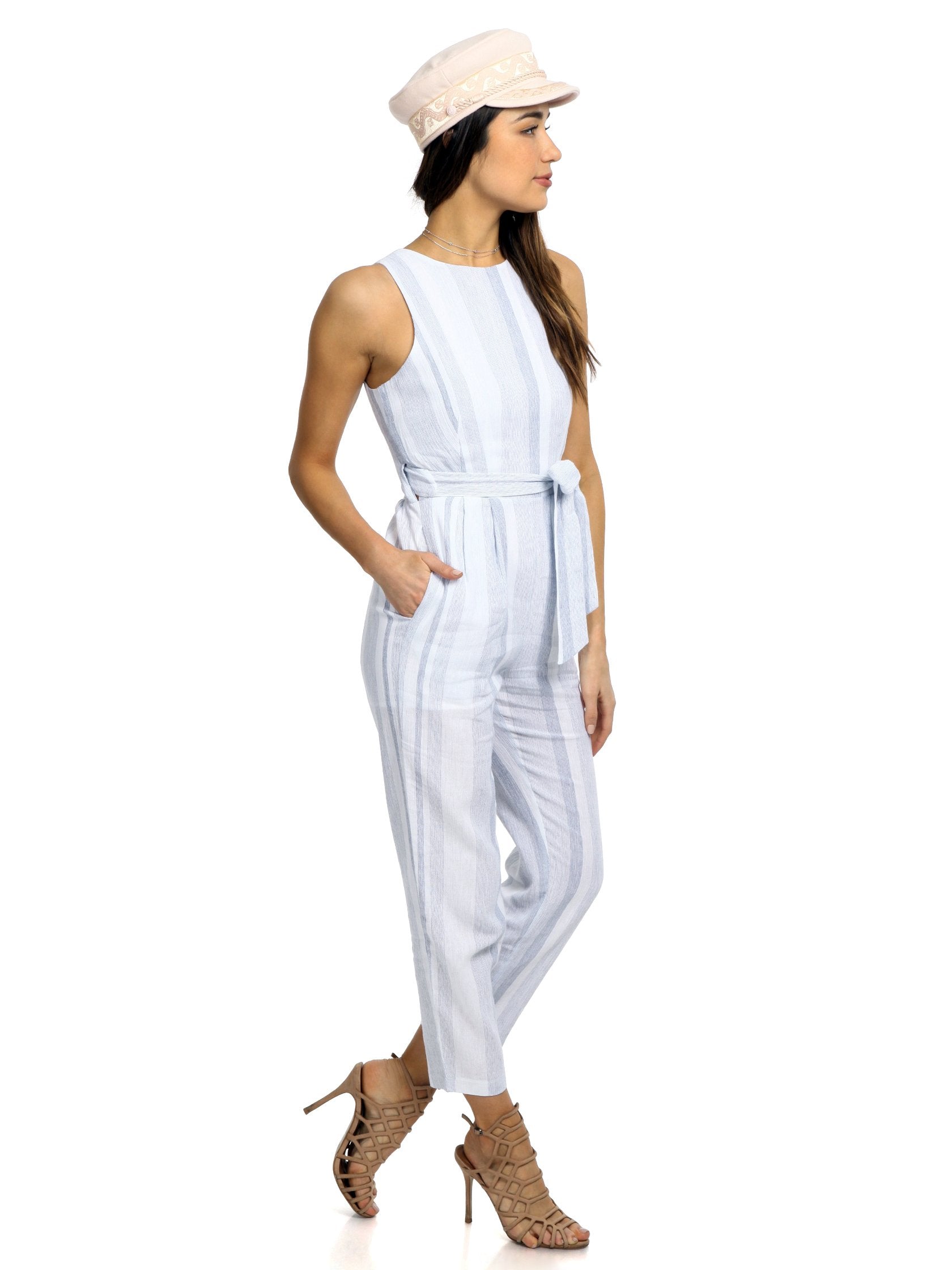 Woman wearing a jumpsuit rental from ASTR called Presley Jumpsuit
