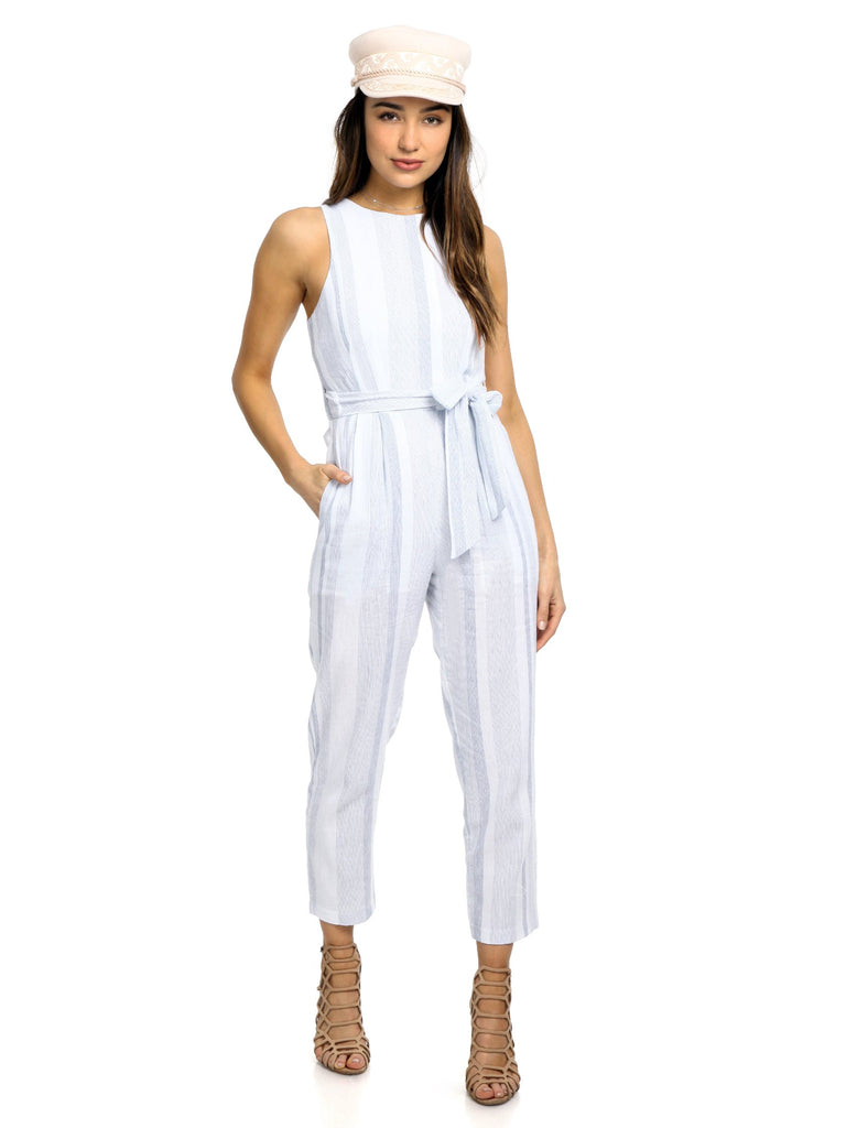 Woman wearing a jumpsuit rental from ASTR called Crystal Pleated Kimono Tie Front Top