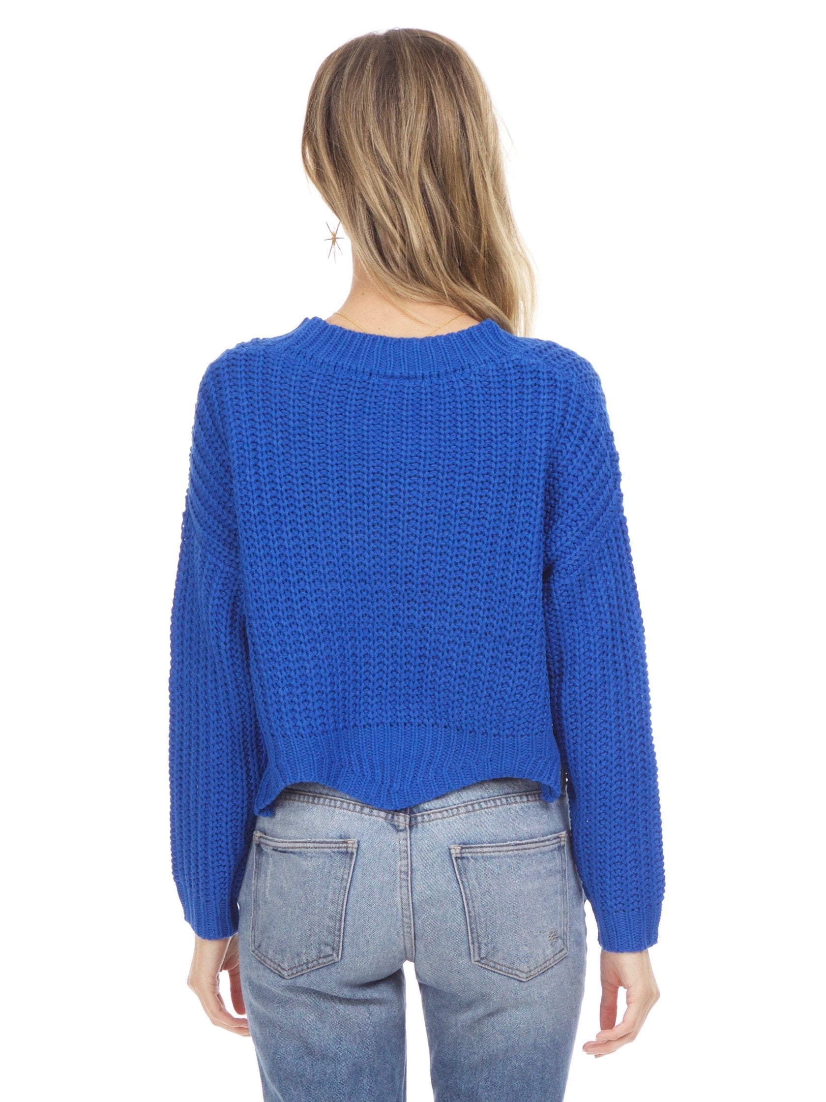 Women outfit in a sweater rental from Sadie & Sage called Scallop Hem Knit Sweater