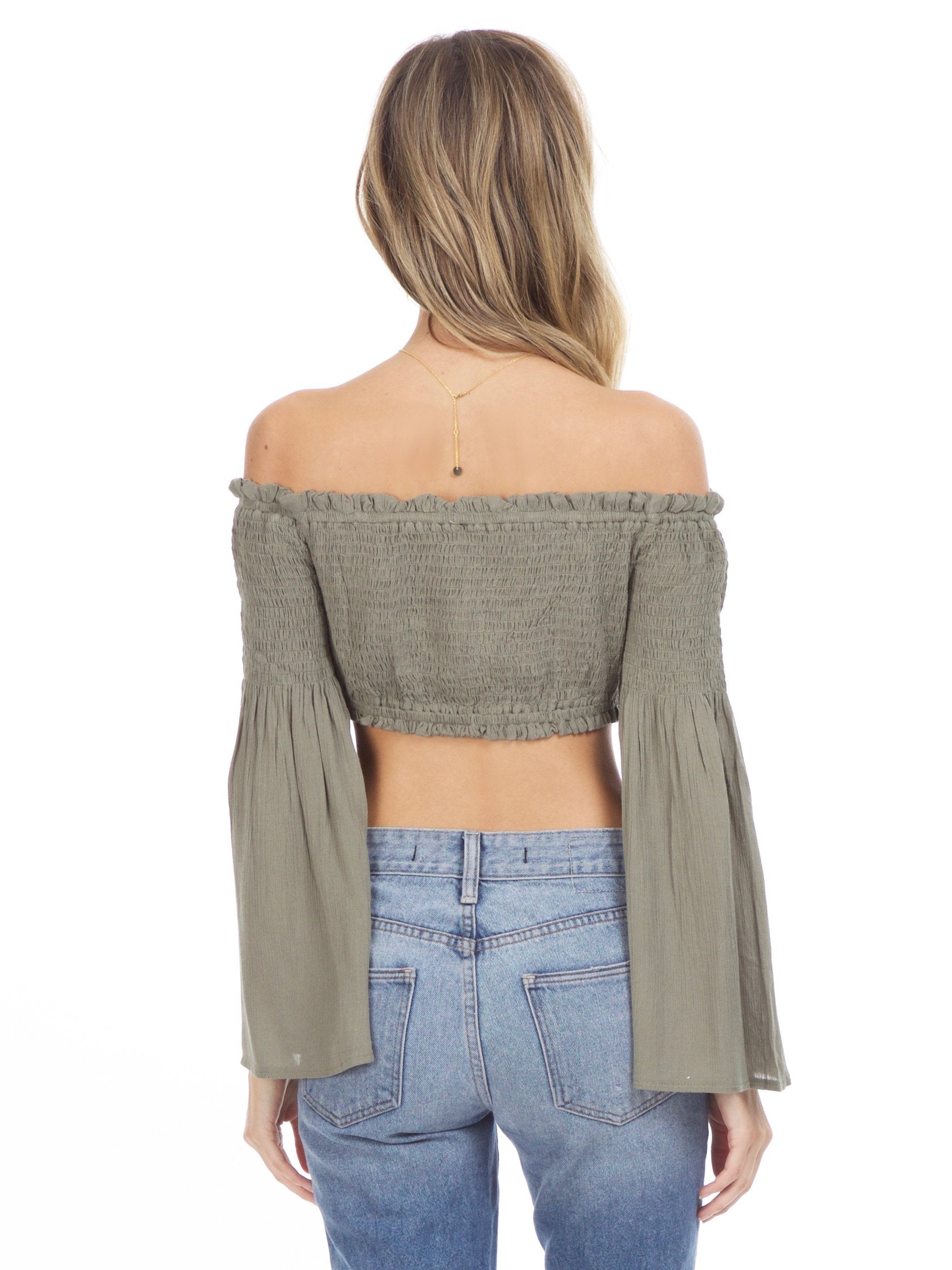 Women outfit in a top rental from Sadie & Sage called Olive Crop Top