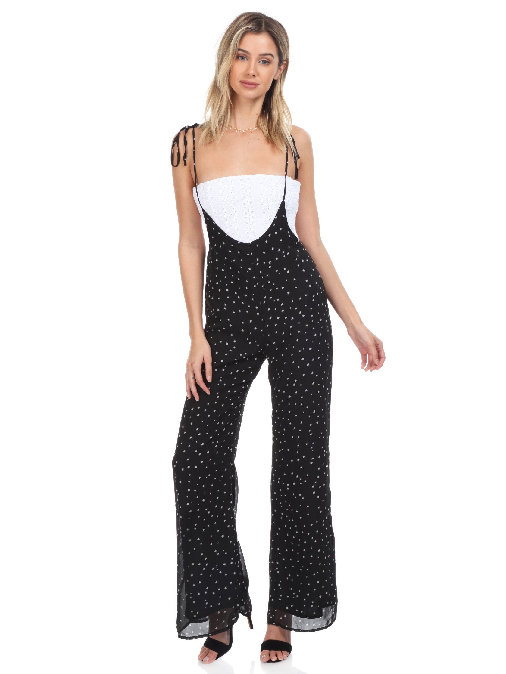Girl outfit in a jumpsuit rental from FashionPass called Sasha Star Print Jumpsuit