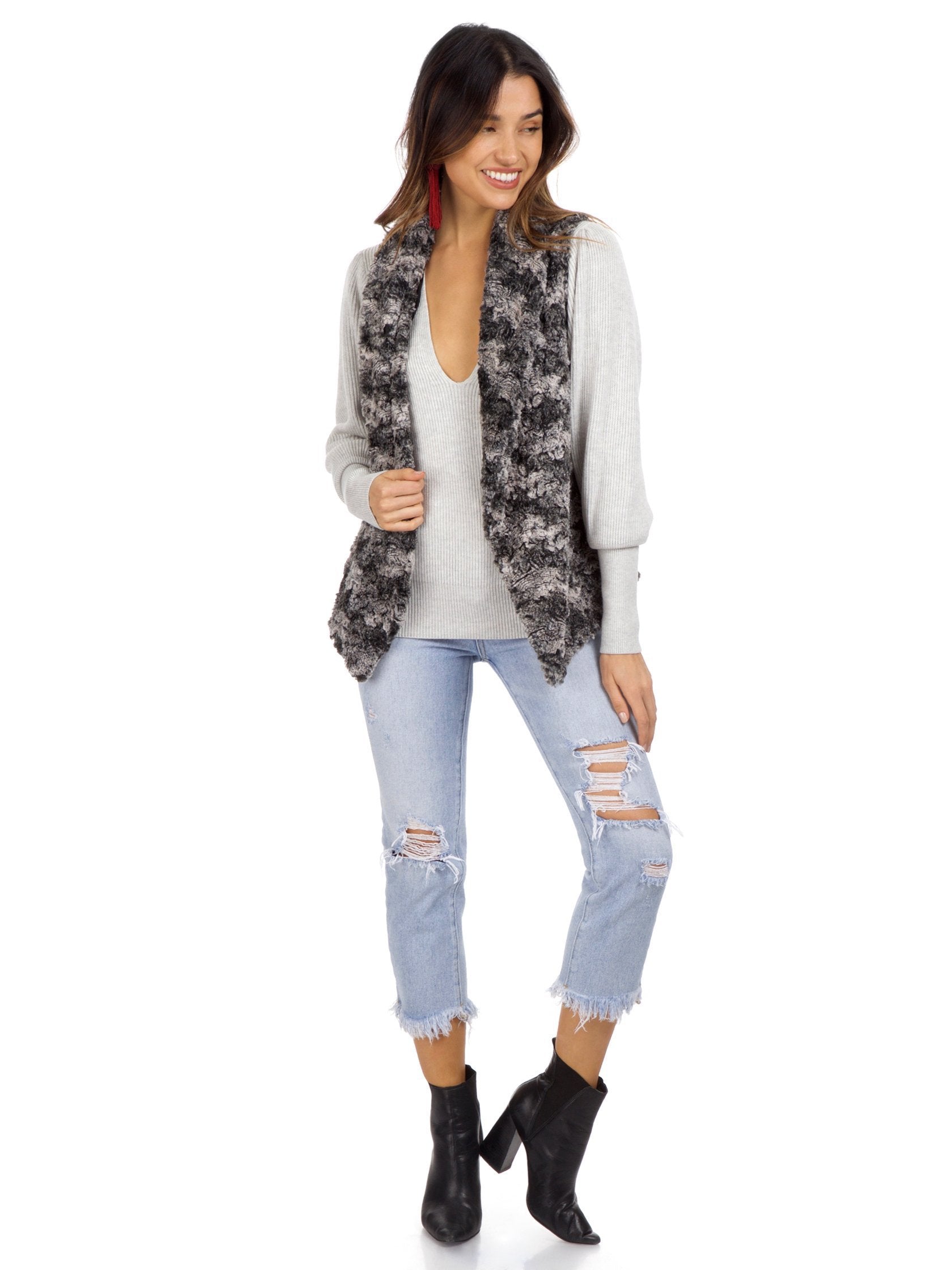 Women outfit in a vest rental from Show Me Your Mumu called Fausta Vest Wolfpack Faux Fur Vest