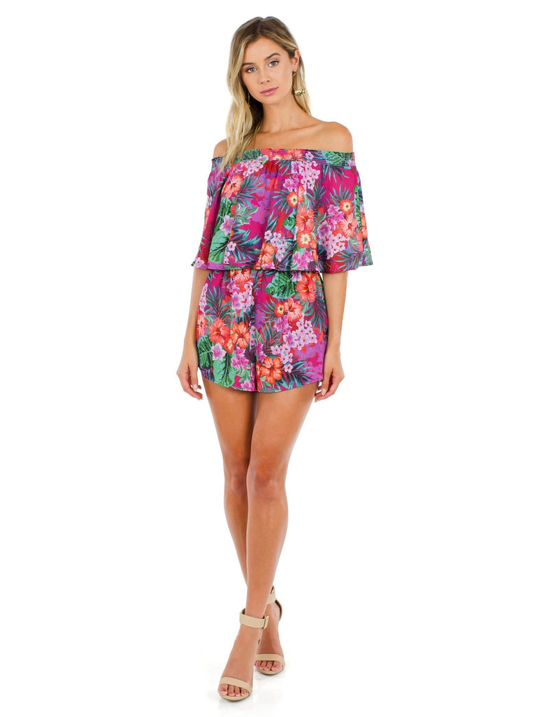 Woman wearing a romper rental from Show Me Your Mumu called Serena Smocked Tassel Shorts
