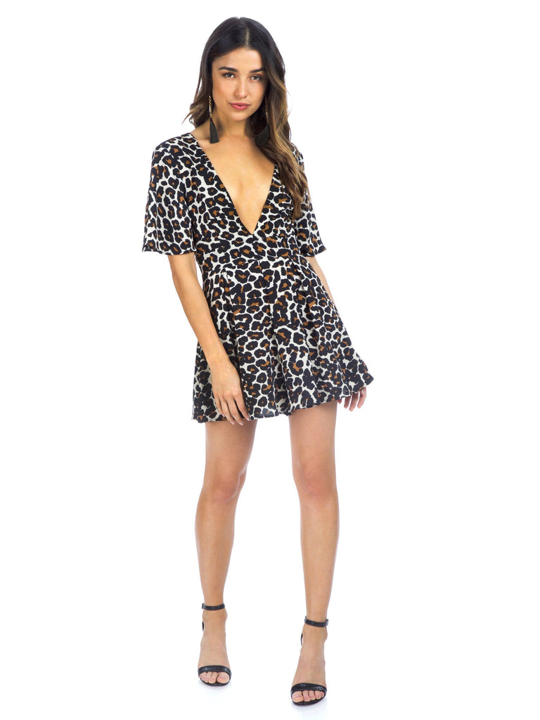 Woman wearing a romper rental from Show Me Your Mumu called Nica Ruffle Top