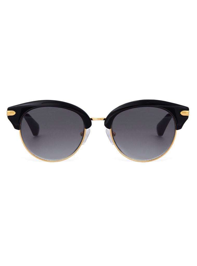 Woman wearing a sunglasses rental from Sonix called Melrose 51mm Gradient Cat Eye Sunglasses