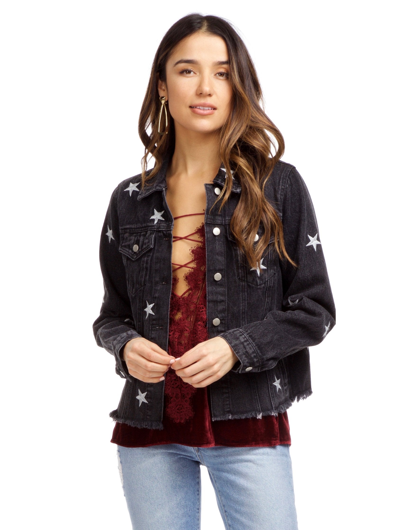 Woman wearing a jacket rental from FashionPass called Stardust Denim Jacket