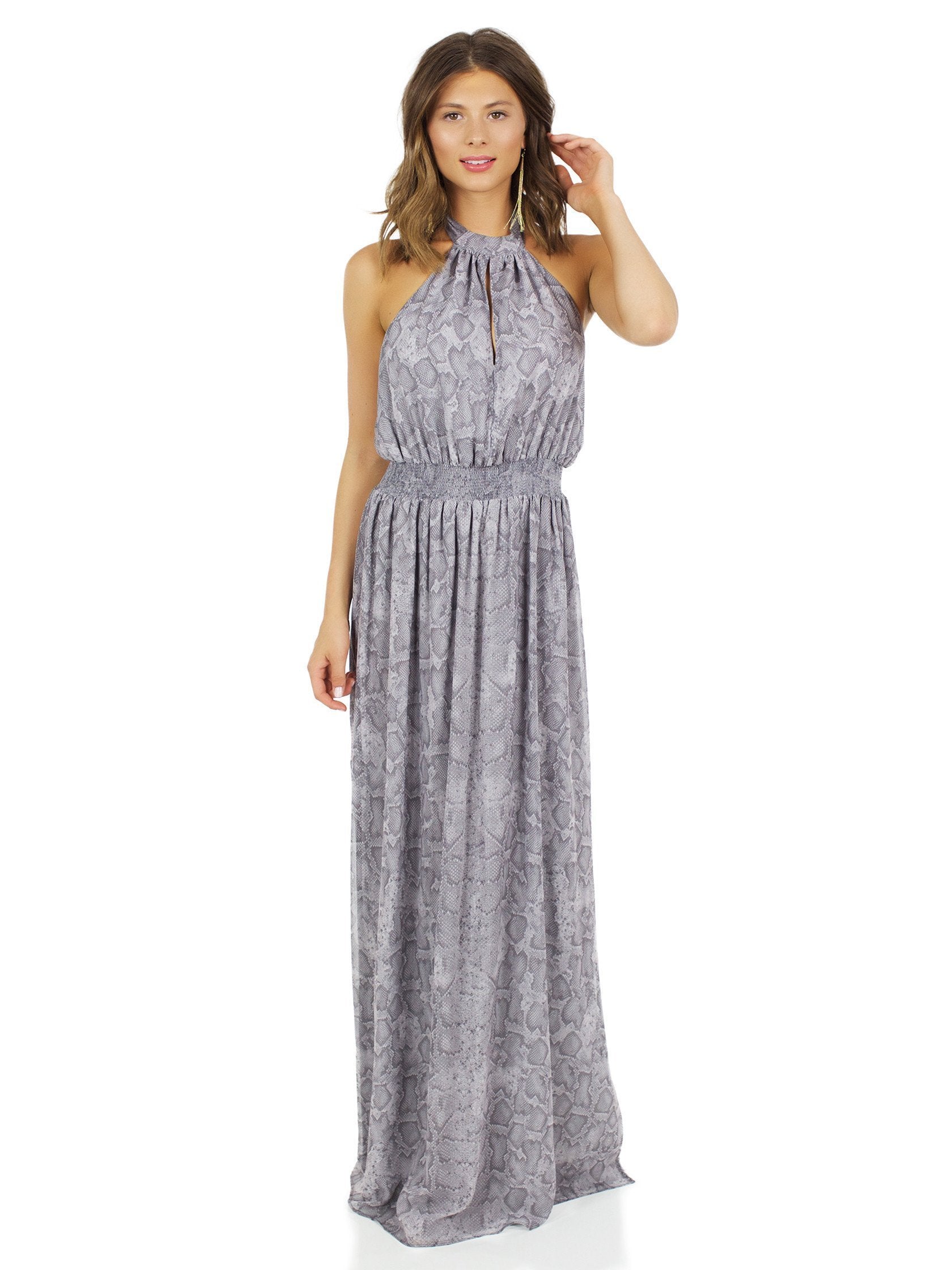 Girl outfit in a dress rental from The Jetset Diaries called Medusa Maxi Dress