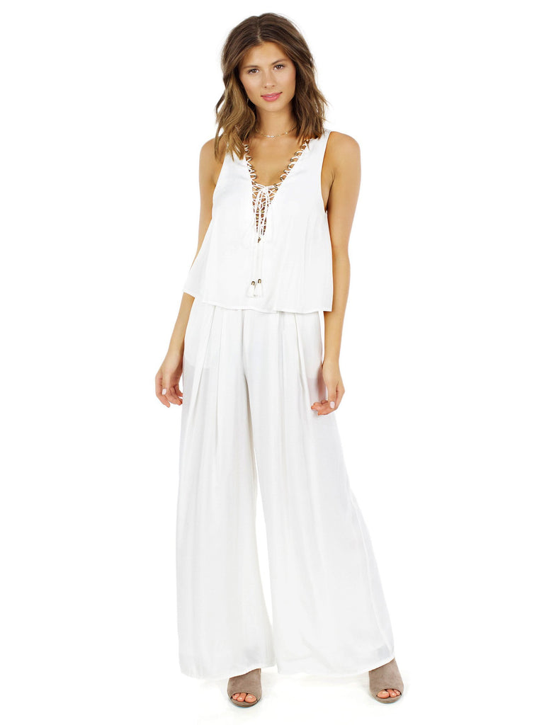 Woman wearing a jumpsuit rental from The Jetset Diaries called Charleston Romper