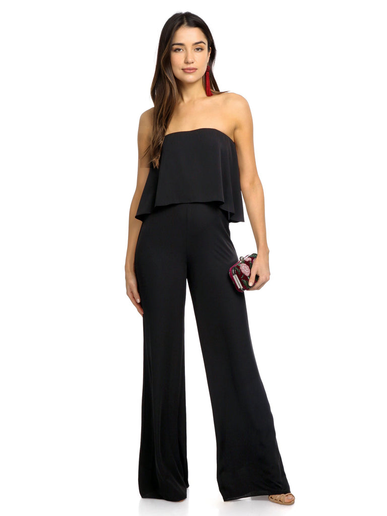 Woman wearing a jumpsuit rental from Amanda Uprichard called Viper Velvet Bodycon
