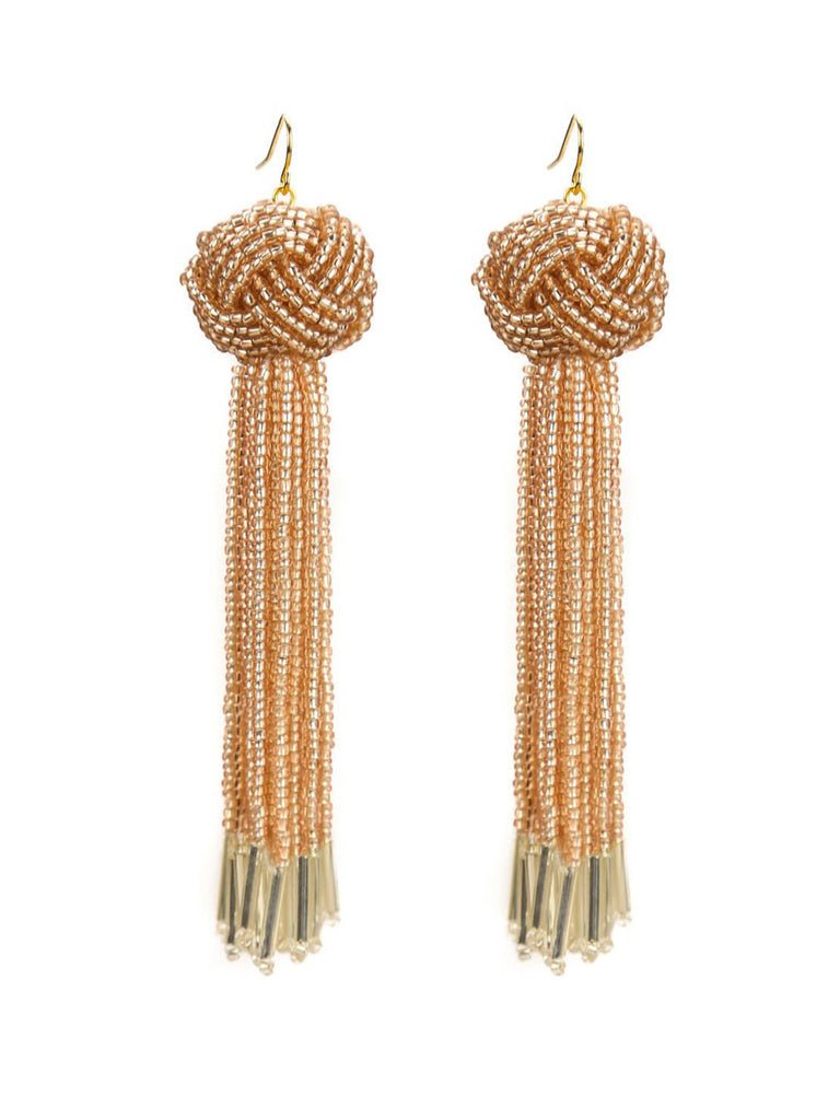 Woman wearing a earrings rental from Vanessa Mooney called The Astrid Knotted Tassel Earrings