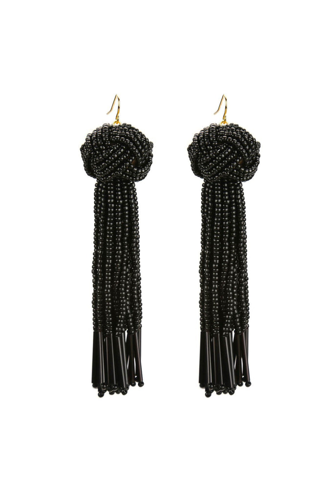 Girl outfit in a earrings rental from Vanessa Mooney called The Astrid Knotted Tassel Earrings