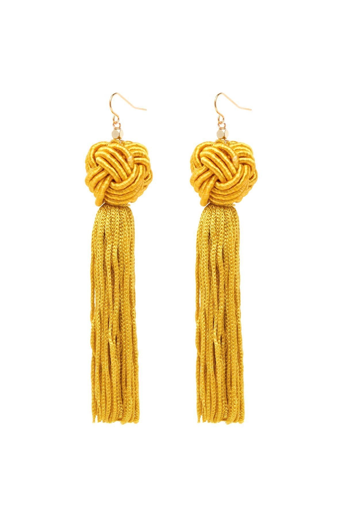 Girl wearing a earrings rental from Vanessa Mooney called The Astrid Gold Knotted Tassel Earrings