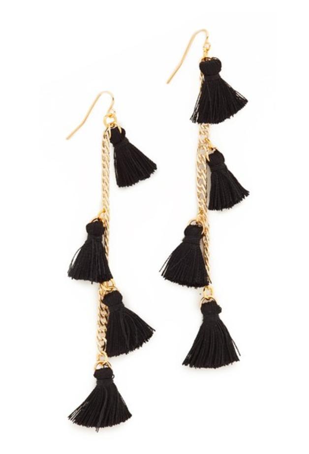 Girl wearing a earrings rental from Vanessa Mooney called The Astrid Knotted Tassel Earrings