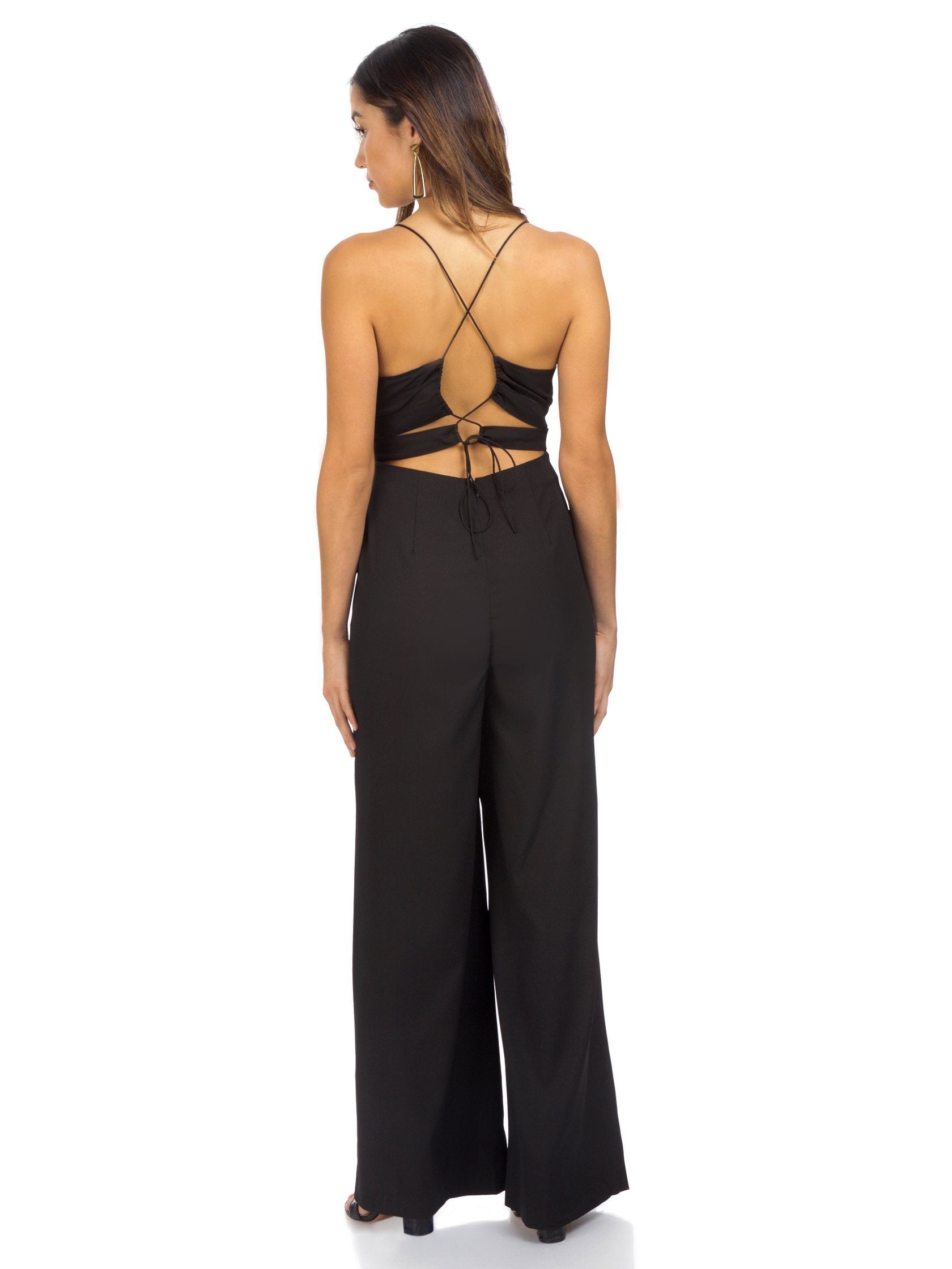 Women wearing a jumpsuit rental from YUMI KIM called Light My Fire Jumpsuit
